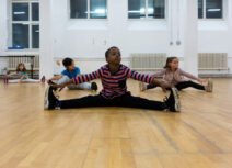 Boy doing splits and stretching