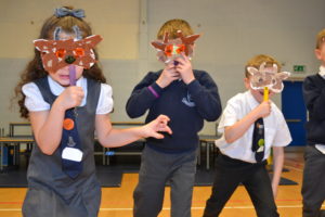 Primary school pupils wearing handmade masks