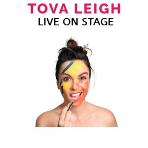 Title text "Tova Leigh Live on Stage" above a photo of woman with yellow, orange and blue face paint on