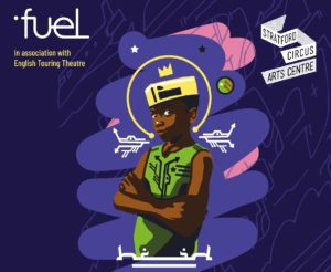 Purple background, picture of a boy wearing a yellow crown and green sleeveless top and a yellow crown. He has his arms crossed.