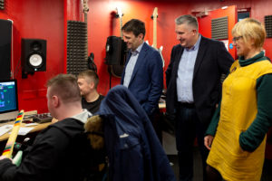 Andy Burnham - Mayor of Greater Manchester, Daren Whitaker - MD of Renaker Build Ltd and Liz O'Neill, CEO of Z-arts observe a music technology workshop