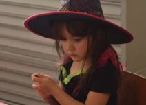 Little girl dressed as witch