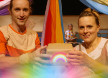 Man and woman holding rainbow box