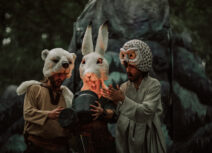 People dressed as owl, hare and bear