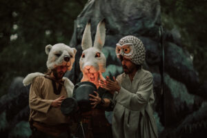 People dressed as owl, hare and bear