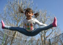 Child doing splits in the air