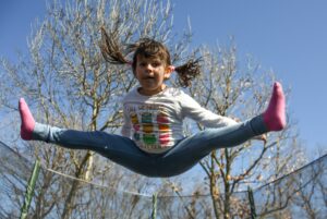 Child doing splits in the air